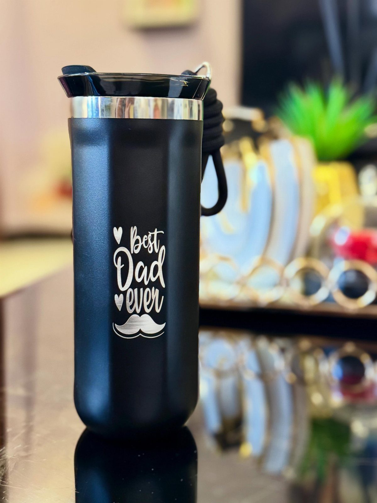 Black travel coffee mug with Best Dad ever text and mustache graphic.