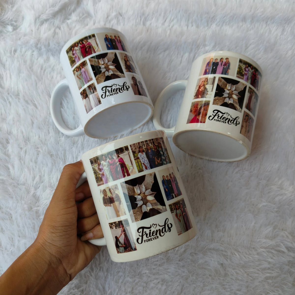 Three white ceramic mugs with photo collages and Friends Forever text on white fur.
