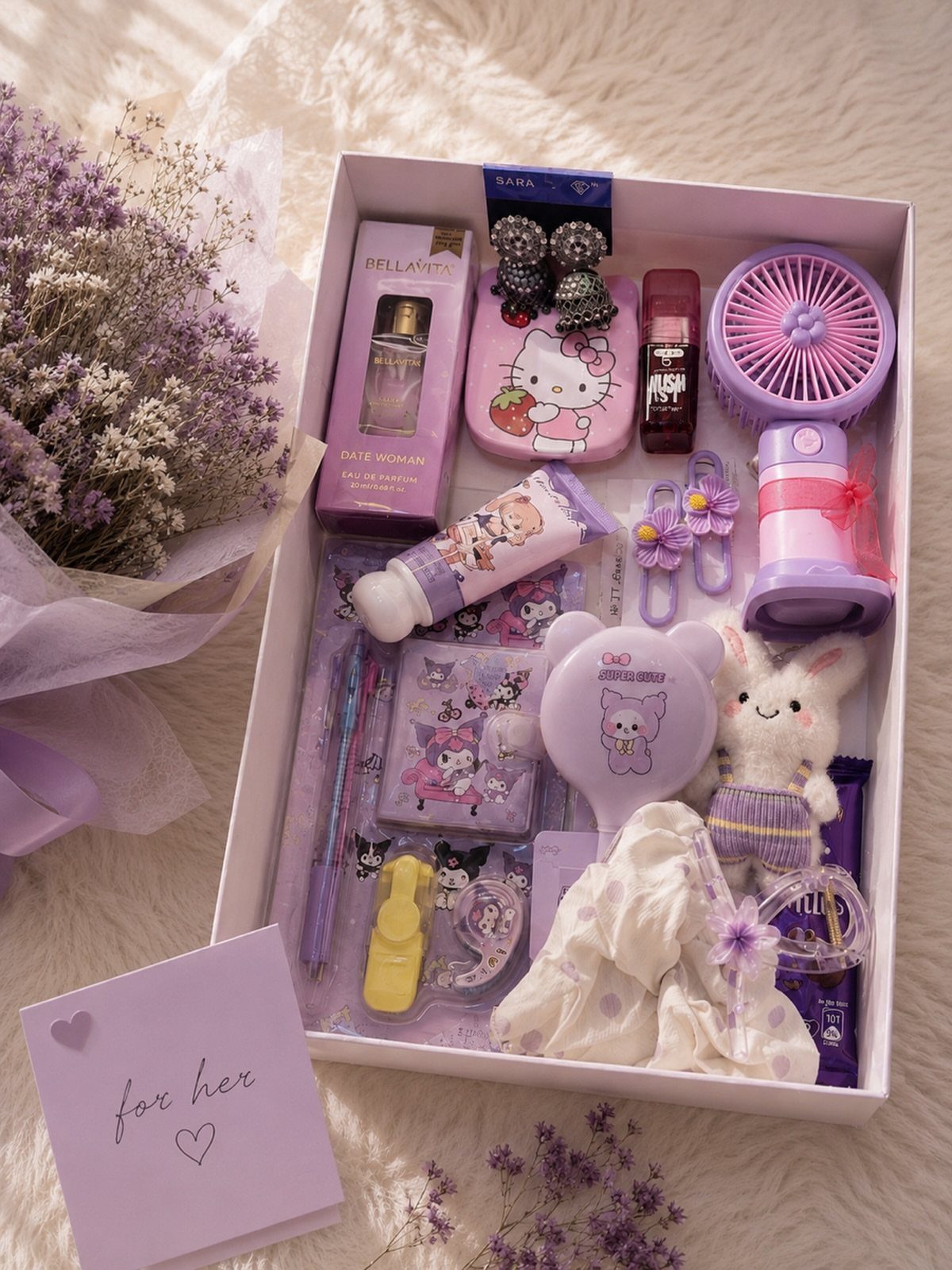 Purple themed gift box for women with beauty products, a fan, and plushie.
