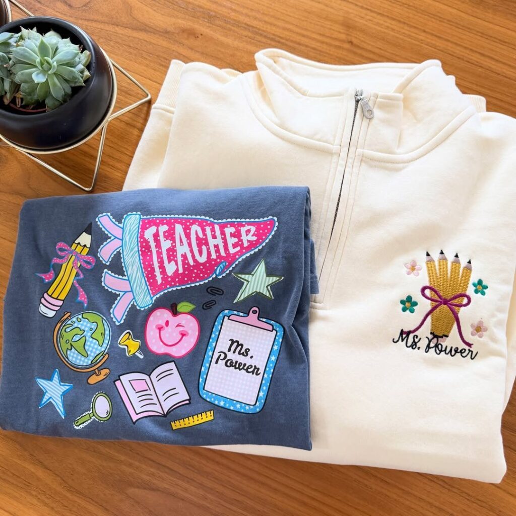 Custom teacher shirts including a navy t-shirt and cream pullover with personalized names.