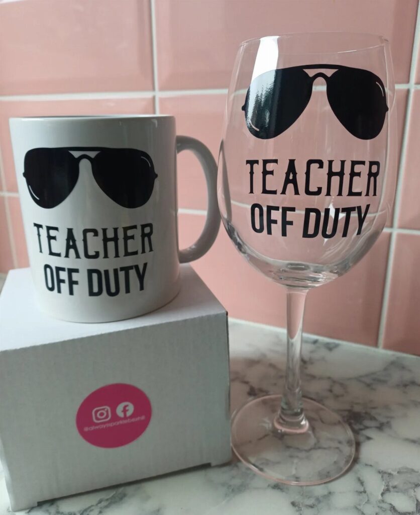 White coffee mug and wine glass with Teacher Off Duty text and sunglasses